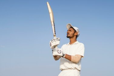 man holding cricket bat
